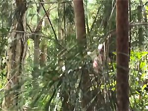 Secret video recording of couple nailing in woods